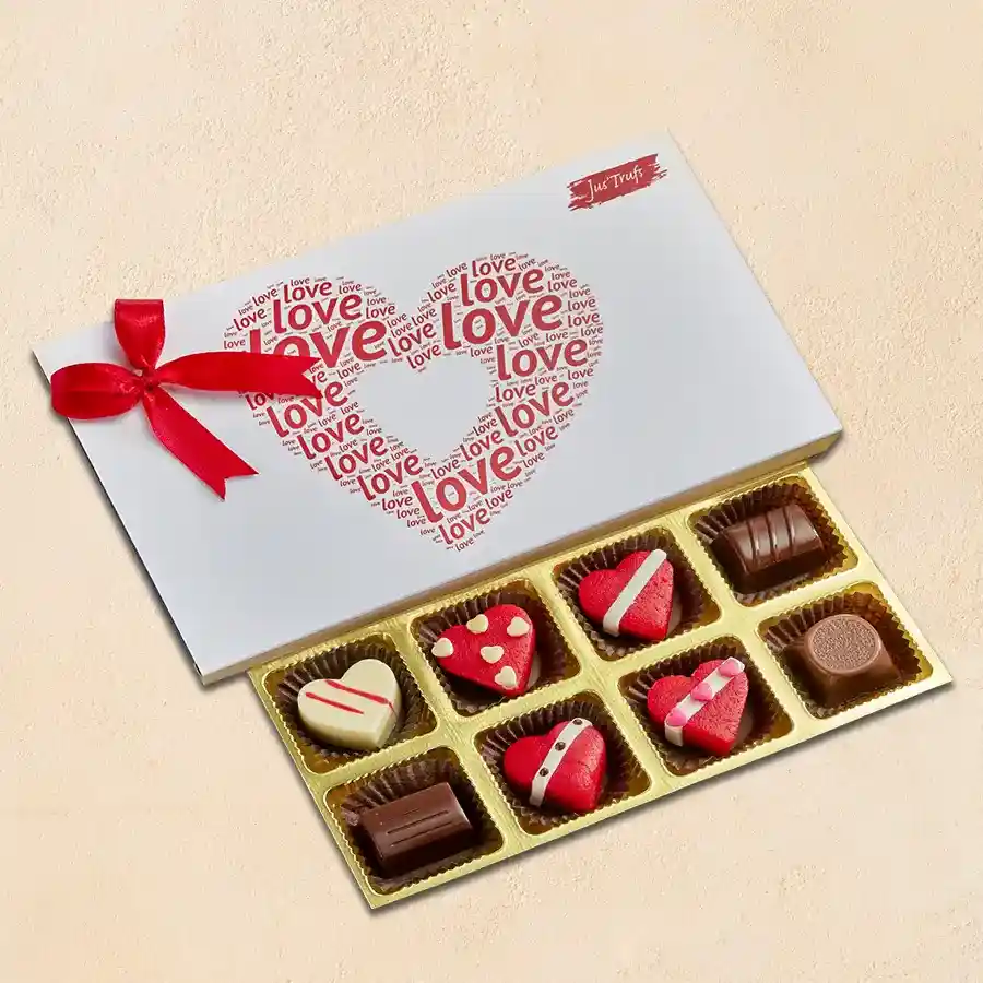 A box of Sweetheart Truffle Treats featuring 4 classic truffles and 4 heart-shaped marzipan truffles, beautifully arranged.