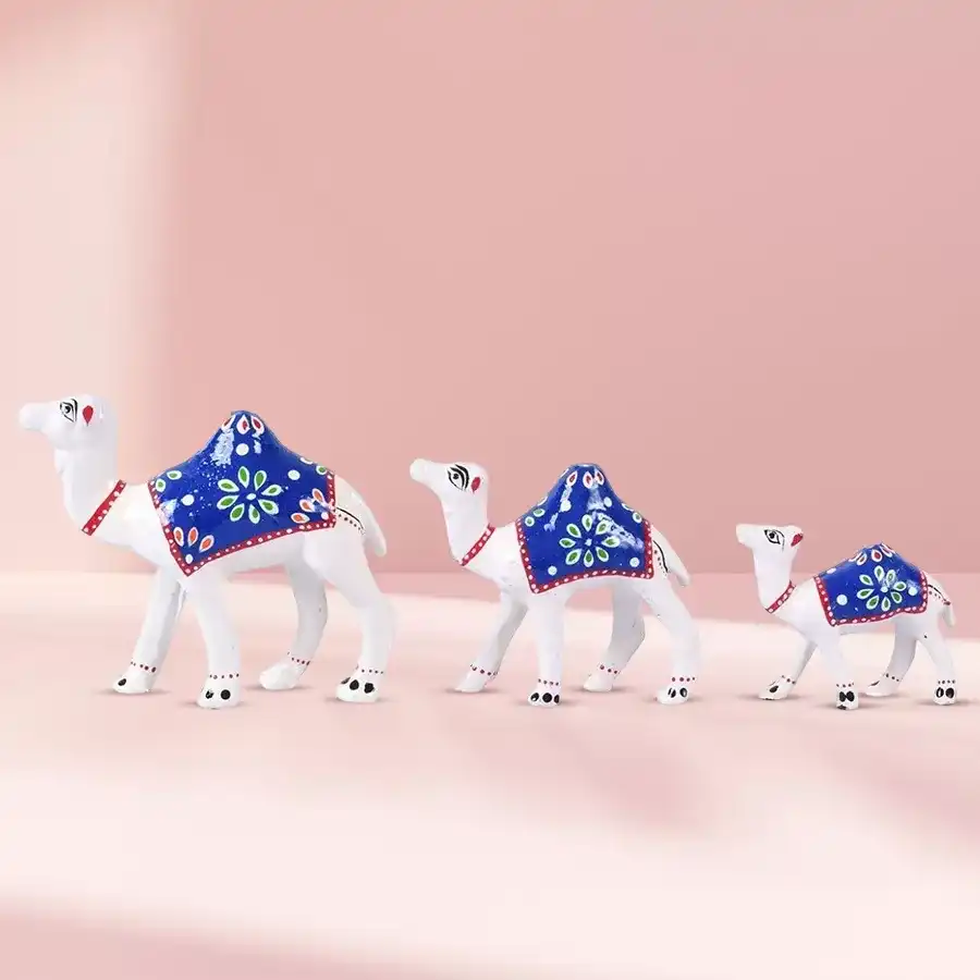 Unique White Camel Showpiece Trio made from paper mache, ideal for gifting and home decor.