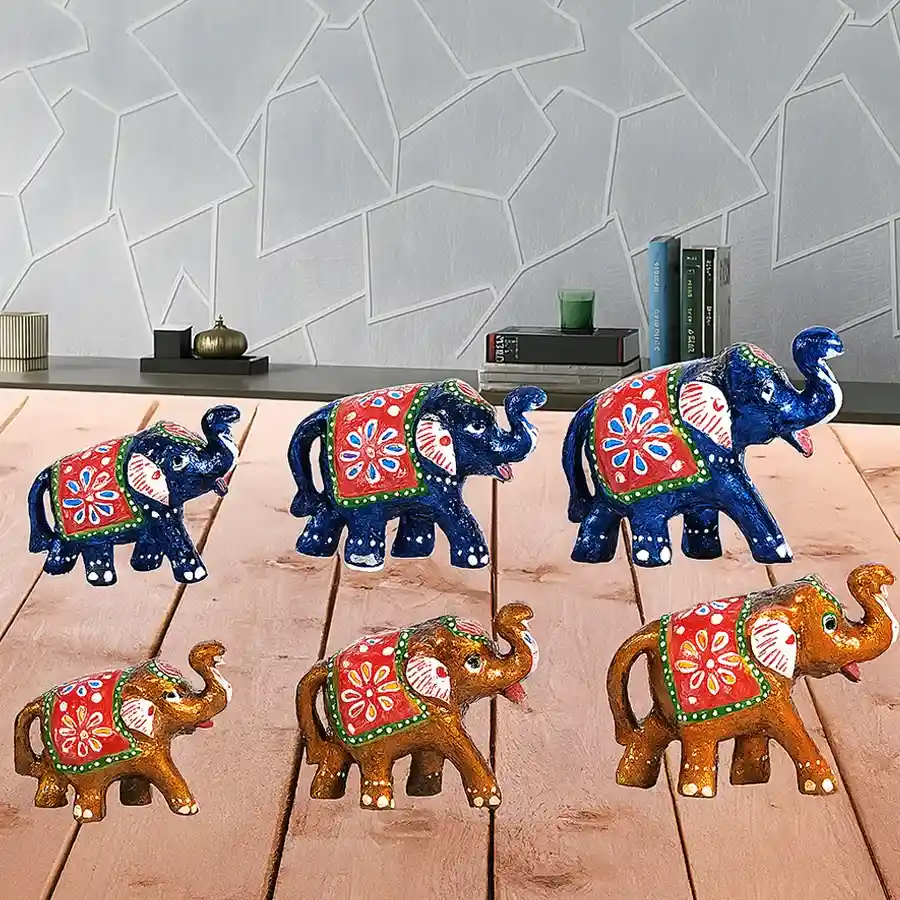 Set of 6 handmade elephant figurines in blue and yellow, showcasing intricate paper mache craftsmanship. Perfect for gifting or decorating.