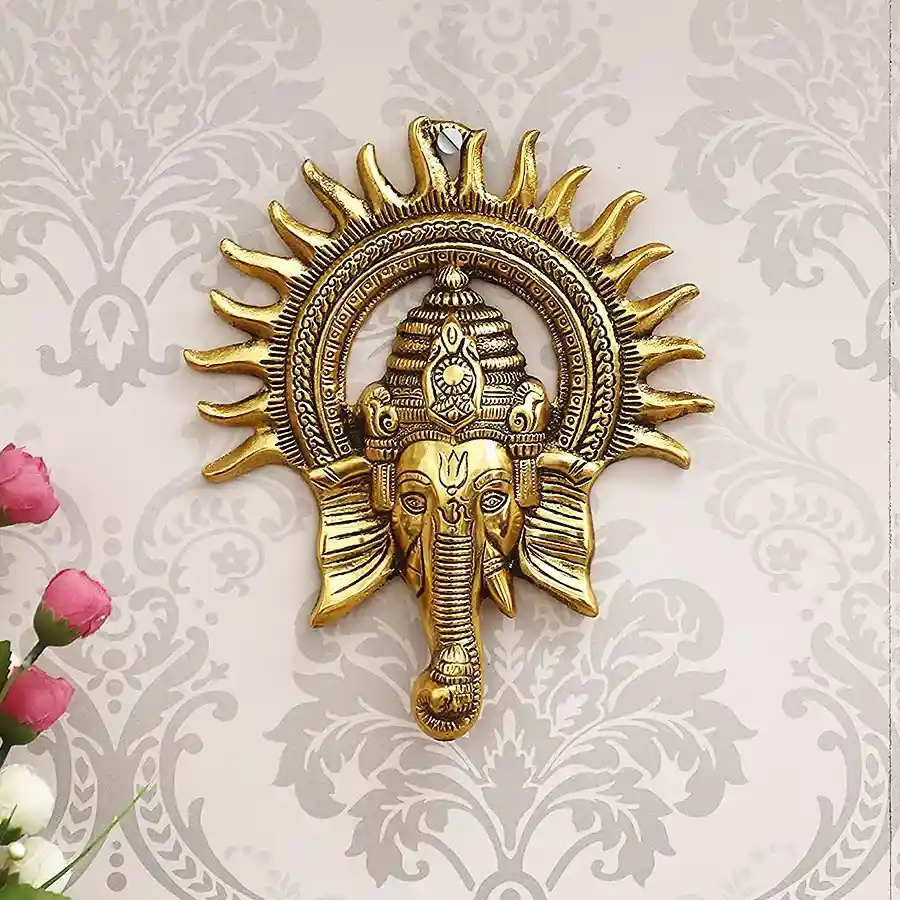 Elegant golden Lord Ganesh wall sculpture crafted from aluminum, perfect for home decor or as a thoughtful gift.
