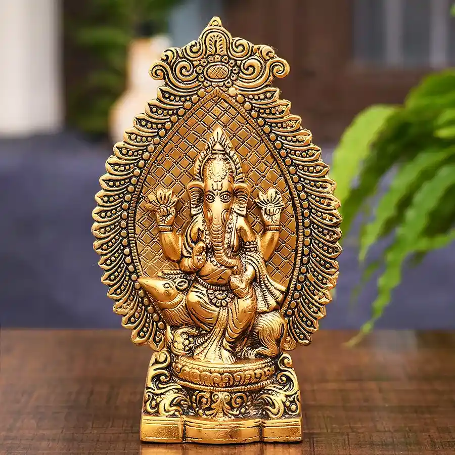 Majestic Golden Ganesh Idol sitting on a mouse, symbolizing wisdom and prosperity.