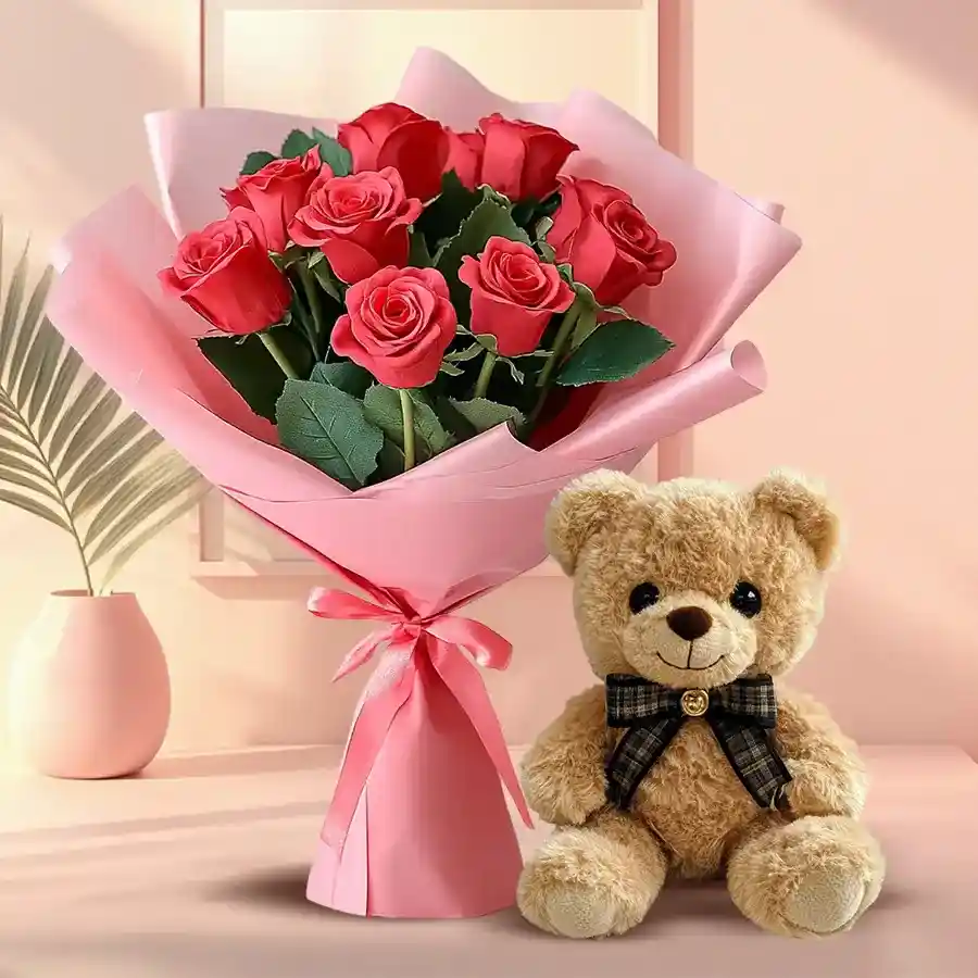 Cute 8-inch teddy bear surrounded by a cluster of red silk roses with heart details on the petals.
