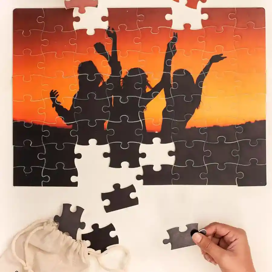 Personalized jigsaw puzzle gift with custom photo and greeting card in a canvas bag.