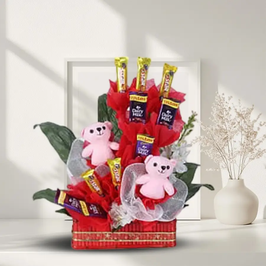 Basket containing two pink teddy bears and an assortment of five Cadbury Five Star bars and Dairy Milk chocolates.