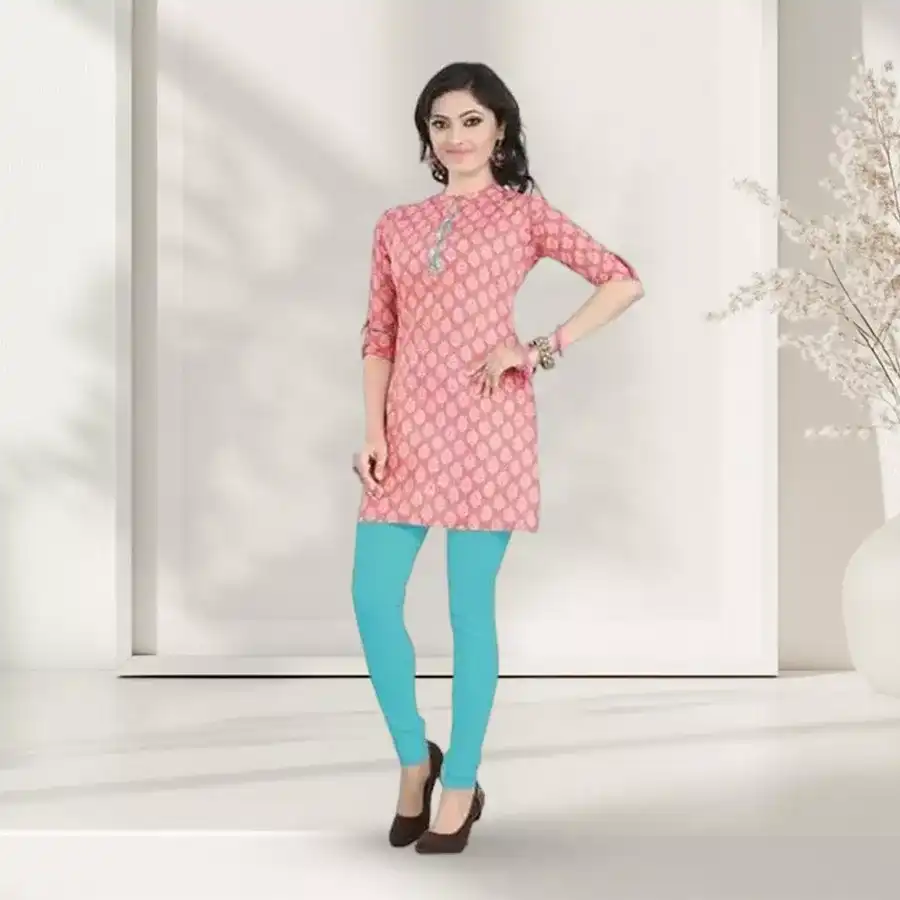 Beautifully designed pink cambric cotton printed kurti displayed elegantly