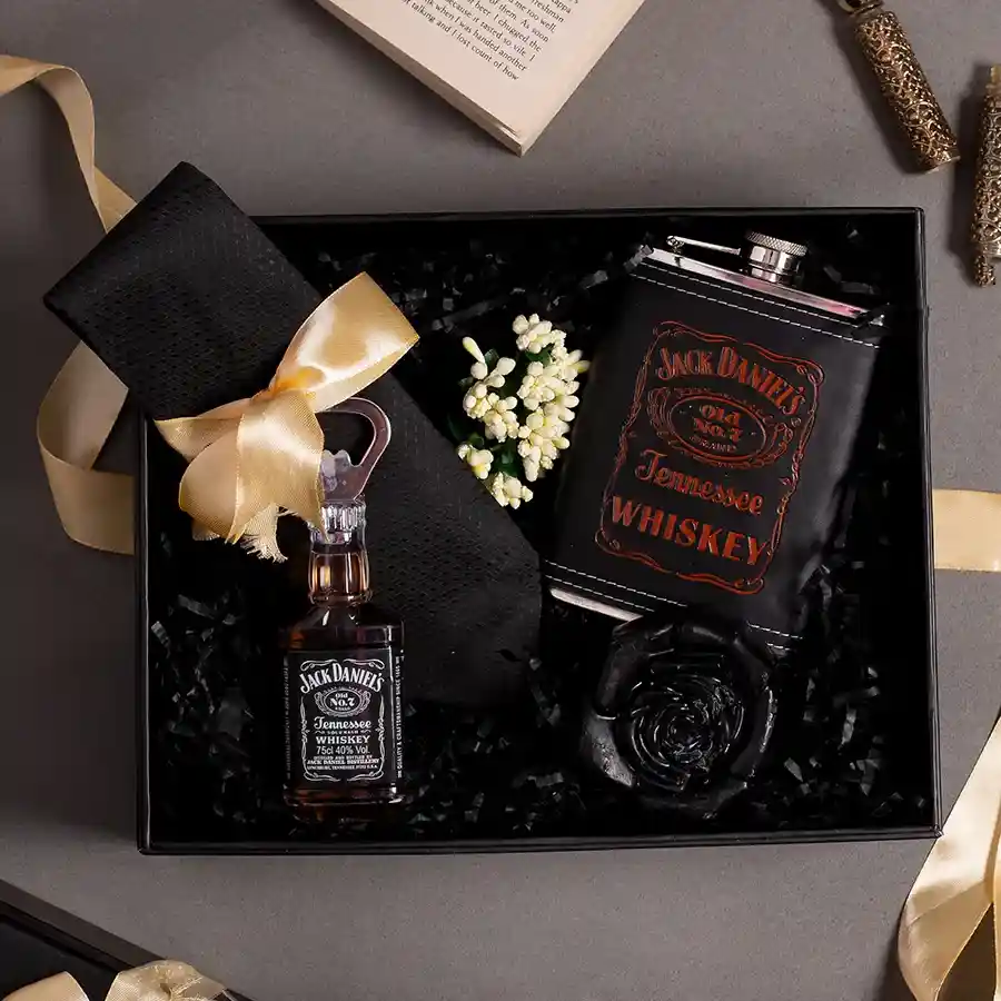 Exclusive Gentleman Gift Kit Hamper showcasing sophisticated essentials including a Jack Daniels hip flask, charcoal soap, tie, and a stylish box.