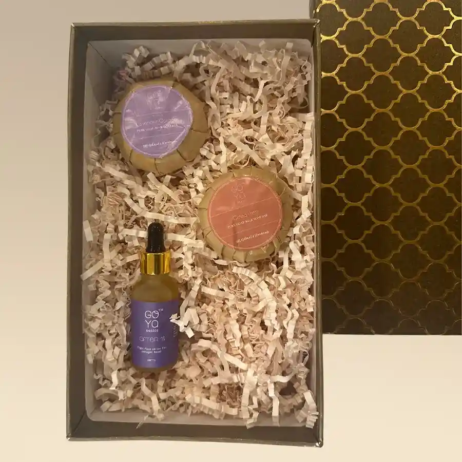 Botanical Bliss Pampering Box featuring goat milk soaps and retinol serum for skincare rejuvenation.