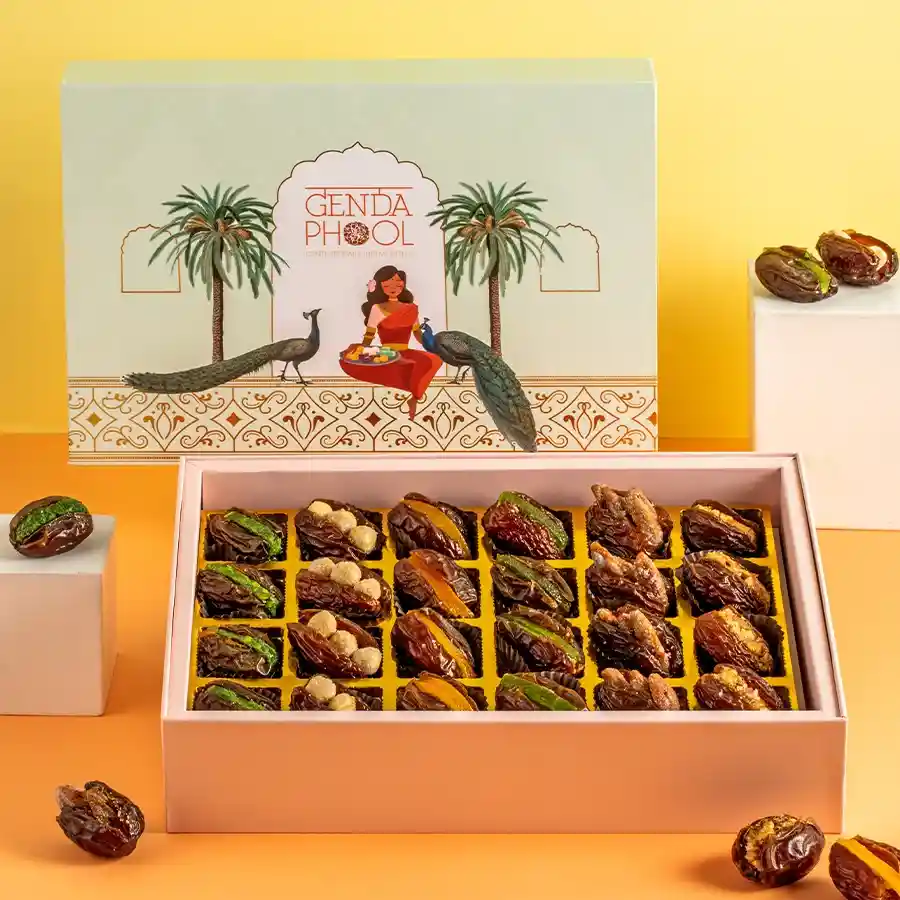 Luxurious Gold-Dusted Medjool Dates in a stylish gift box, featuring gourmet fillings and adorned with 24-carat gold varq.