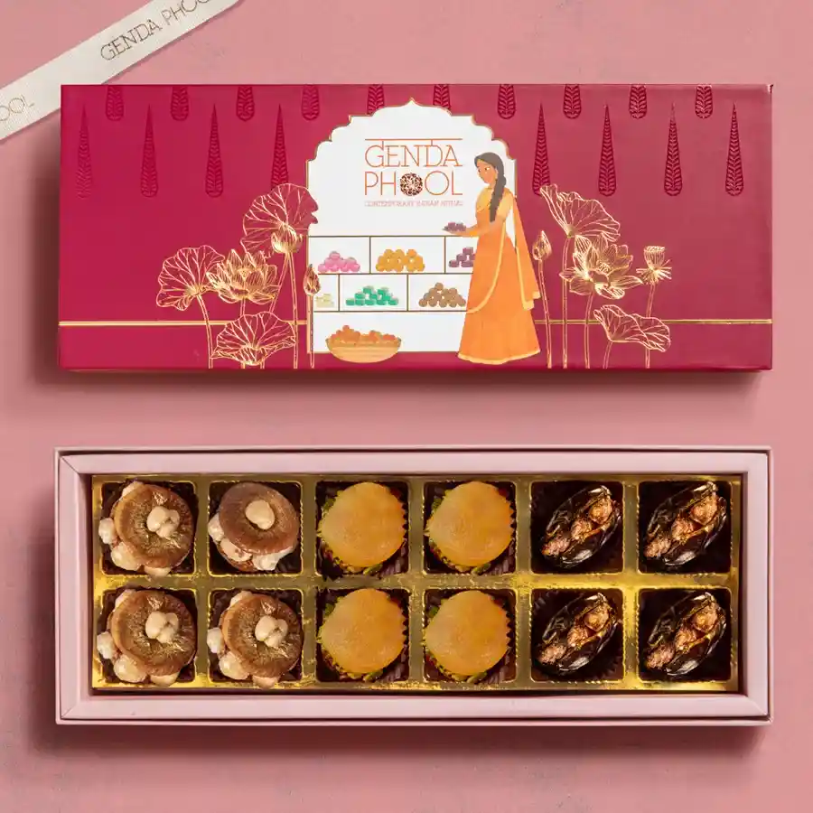 Beautifully arranged gift box featuring gourmet stuffed Medjool dates, apricots, and figs, all adorned with gold varq.