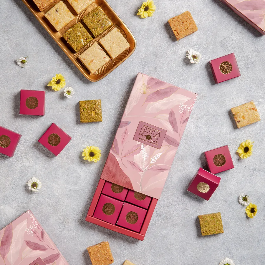 Deluxe Bite Collection featuring Pistachio Rose, Almond Apricot, Hazelnut, and Butterscotch bites in a gourmet gift box.