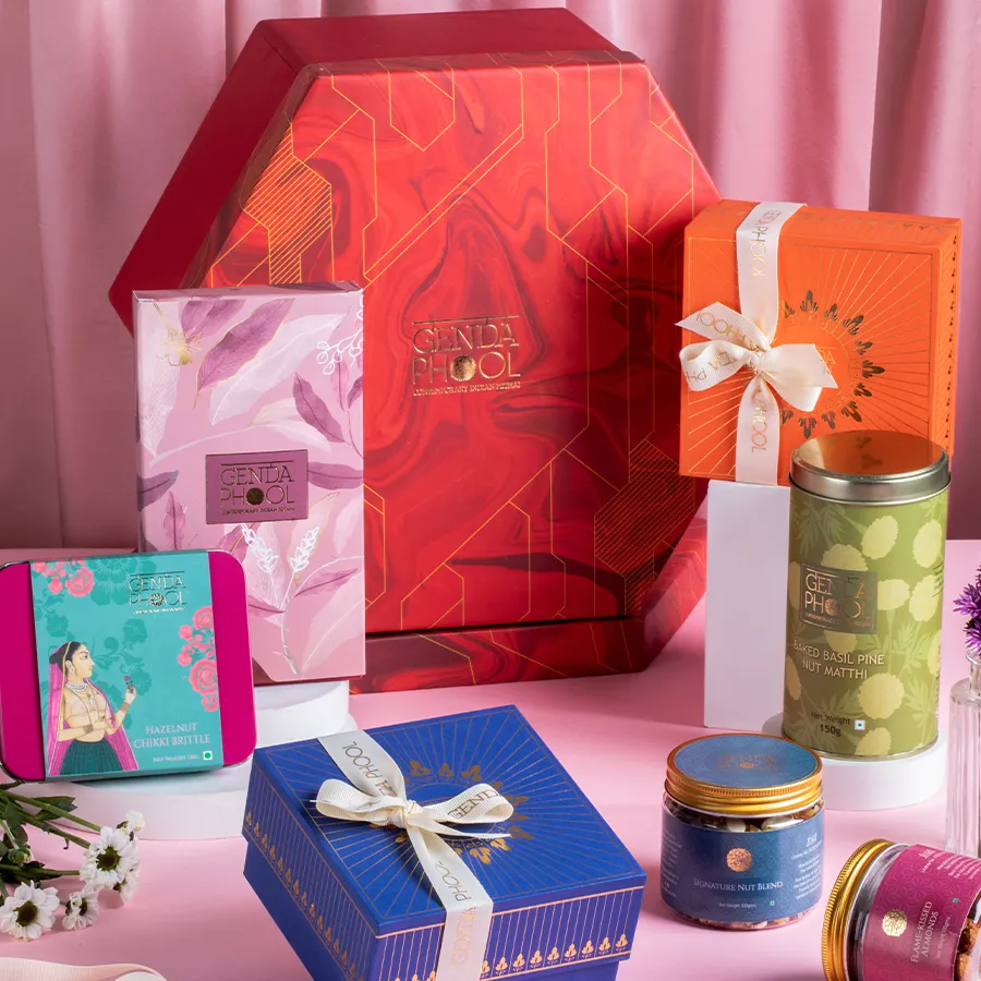 Gourmet Delight Gift Set featuring figs, mithai, chikki, nut blend, roasted almonds, and baked matthi.