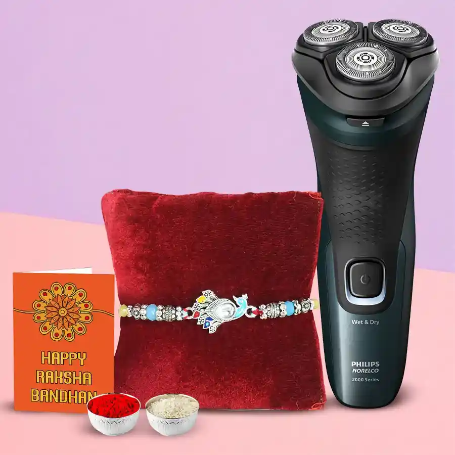 Impressive Rakhi gift set featuring an imported electric shaver, Rakhi, Roli, Tilak, and Chawal arranged together.