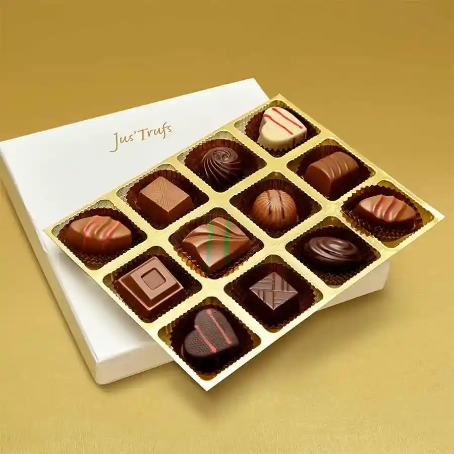 A beautifully arranged box of 12 handcrafted truffles featuring various flavors like Almond, Mint, Strawberry Melody, and Orange Duet, set against a stylish background.