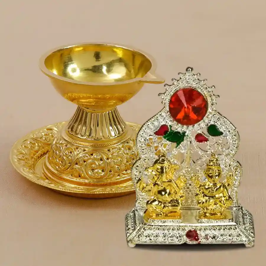 Glistening Ganesh Laxmi Diya Set featuring antique gold-plated diya and brass mandap, ideal for festive celebrations.