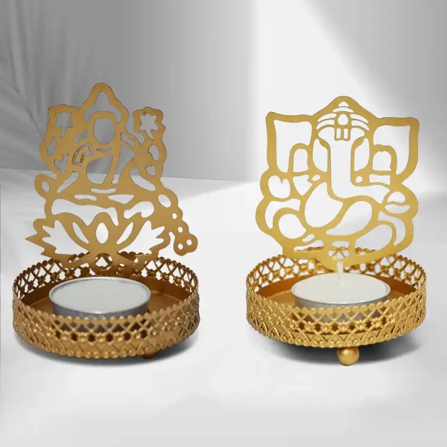 Elegant golden tealight candle holders featuring Ganpati ji and Laxmiji, perfect for spiritual decor and gifting.
