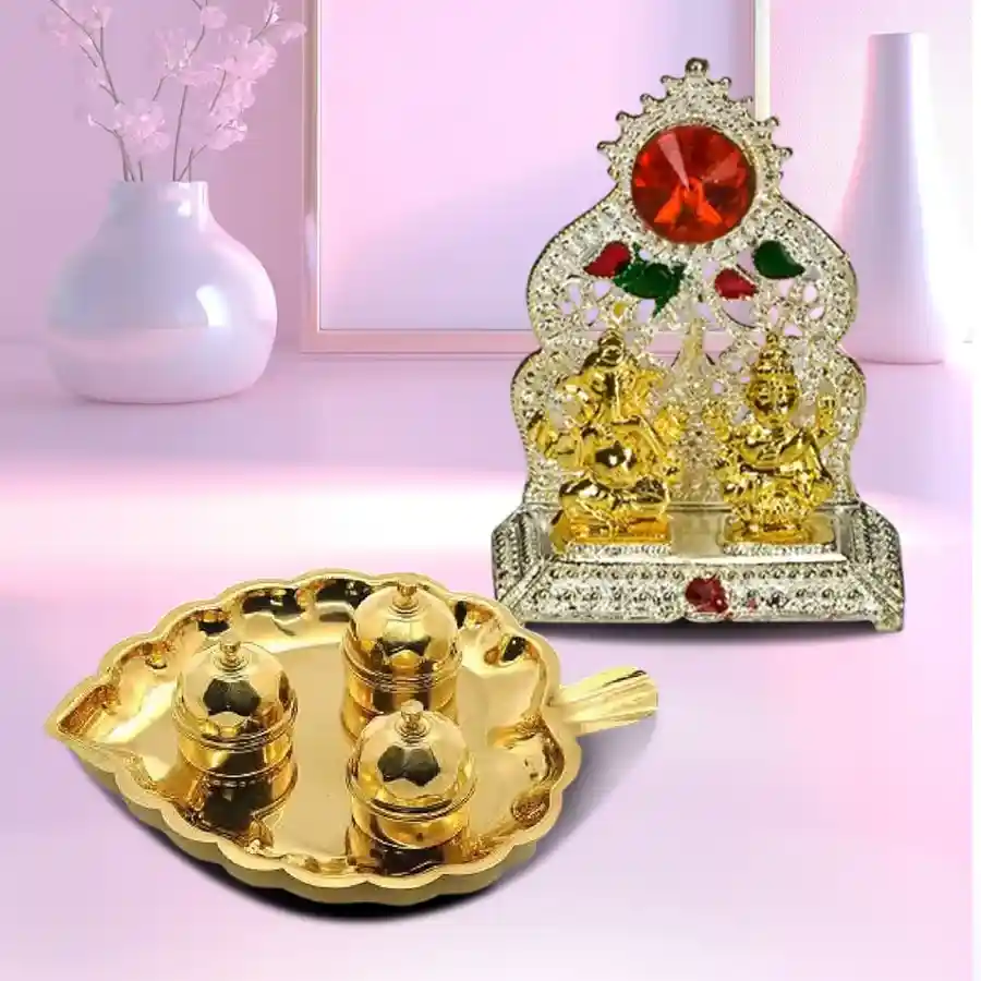 Paan shaped brass thali with dibbis and Ganesh Laxmi mandap, beautifully designed for pooja ceremonies.