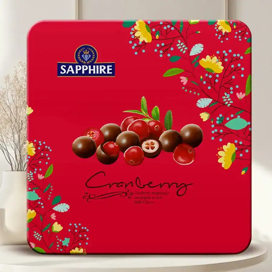 Exquisite Sapphire Cranberry Chocolate Tin featuring rich chocolates and tart cranberries in elegant packaging