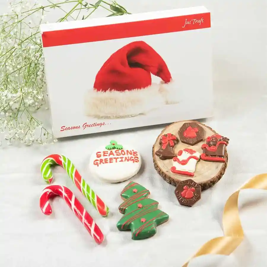 Christmas Cookie and Chocolate Celebration hamper featuring festive cookies, chocolate shapes, and candy canes
