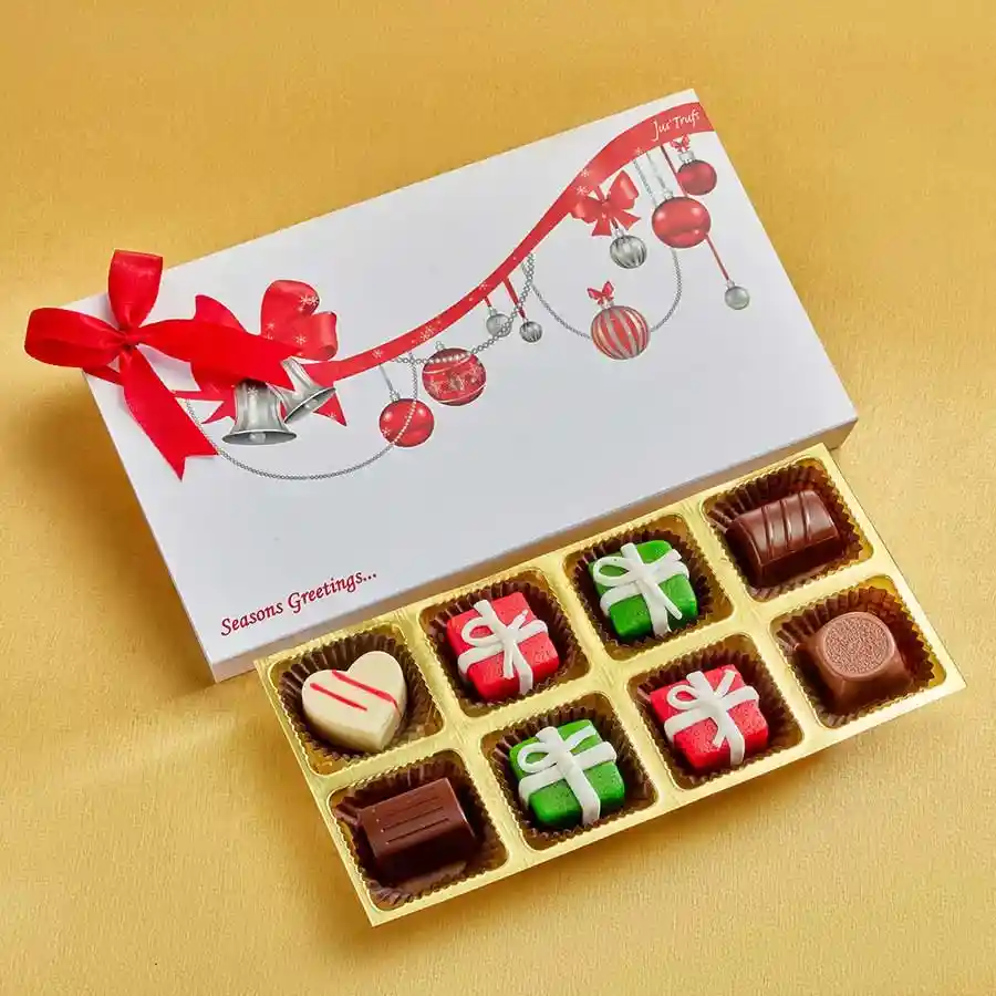 A beautifully arranged box of Festive Truffle & Marzipan Treats, featuring Classic Truffles and Marzipan Truffles, adorned with holiday-themed decorations.