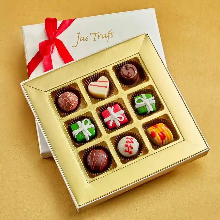 Assorted chocolate truffles and marzipan treats beautifully arranged in an ornate mandala box.