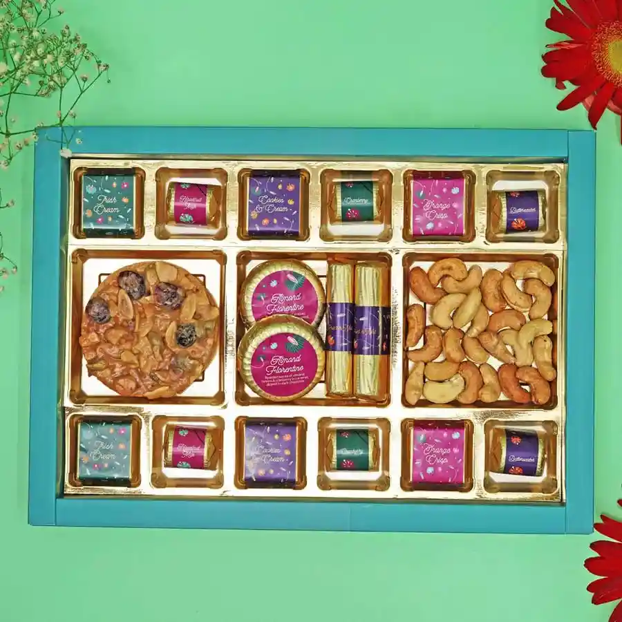 Assorted gourmet chocolates and treats in a beautifully curated gift box