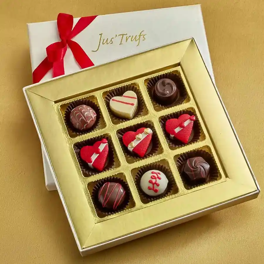 Elegant gift box of Luscious Truffle Assortment featuring six assorted truffles and three heart-shaped marzipan truffles, beautifully presented in a Mandala box.