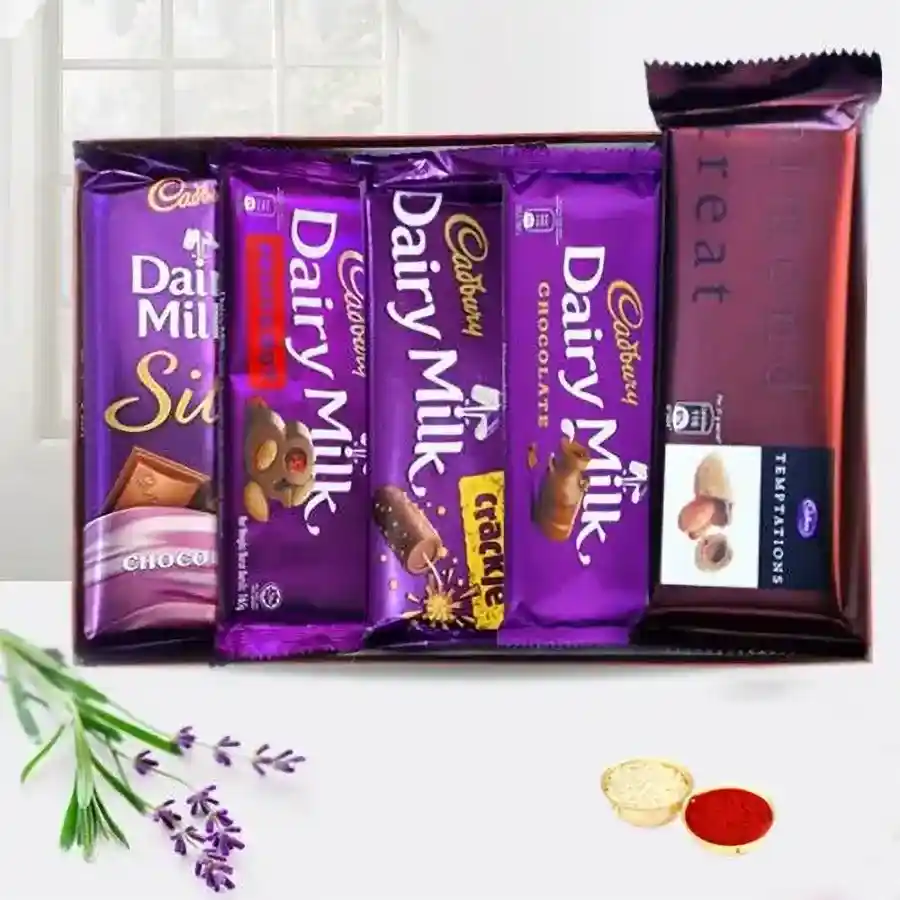 Cadbury Treat of Chocolates pack with Dairy Milk Silk, Fruits & Nuts, Crackle, Temptation, and classic Dairy Milk, accompanied by Roli, Tilak, and Chawal.