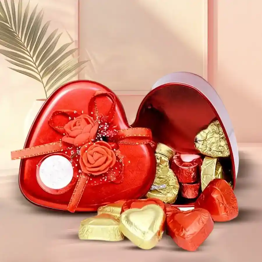 Heart-shaped chocolate box filled with assorted chocolates, decorated elegantly for romantic occasions.