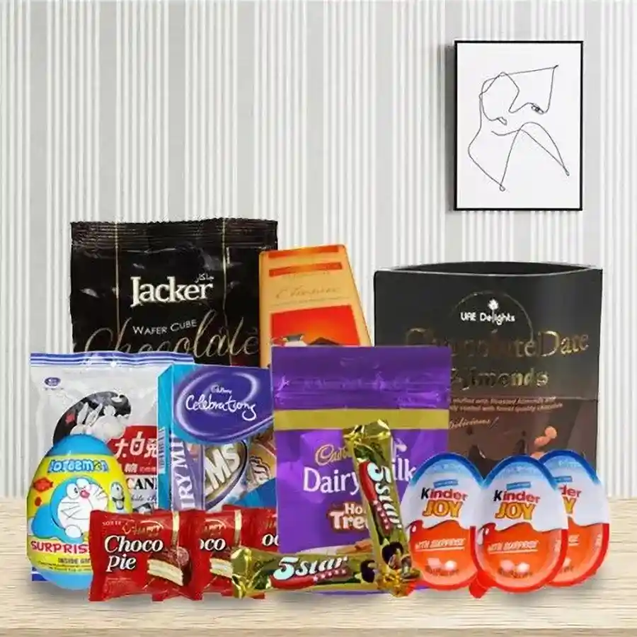 Delicious Chocolate Hamper with assorted chocolates and treats including Cadbury Dairy Milk, Chocolate Date Almonds, White Rabbit, Kinder Joy, 5 Star bars, Chocopies, Honey Dukes, Jacker Wafer Cubes, and Cadbury Celebration Mini.
