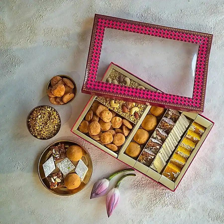 Kesar's Sweet and Savory Surprise Box featuring assorted sweets and savory snacks, perfect for gifting.