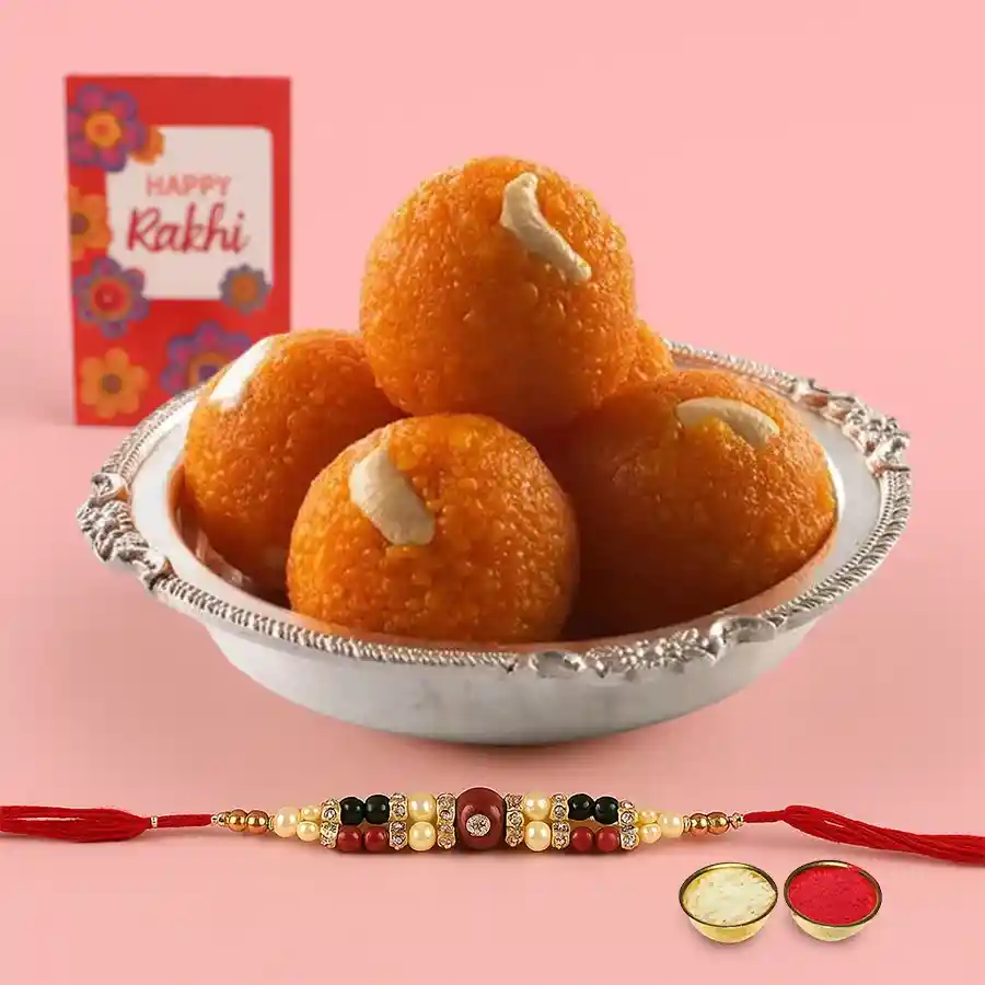 Haldirams Pure Ghee Ladoo (250g) gift set featuring Rakhi, Roli, Tilak, and Chawal for Raksha Bandhan celebration.