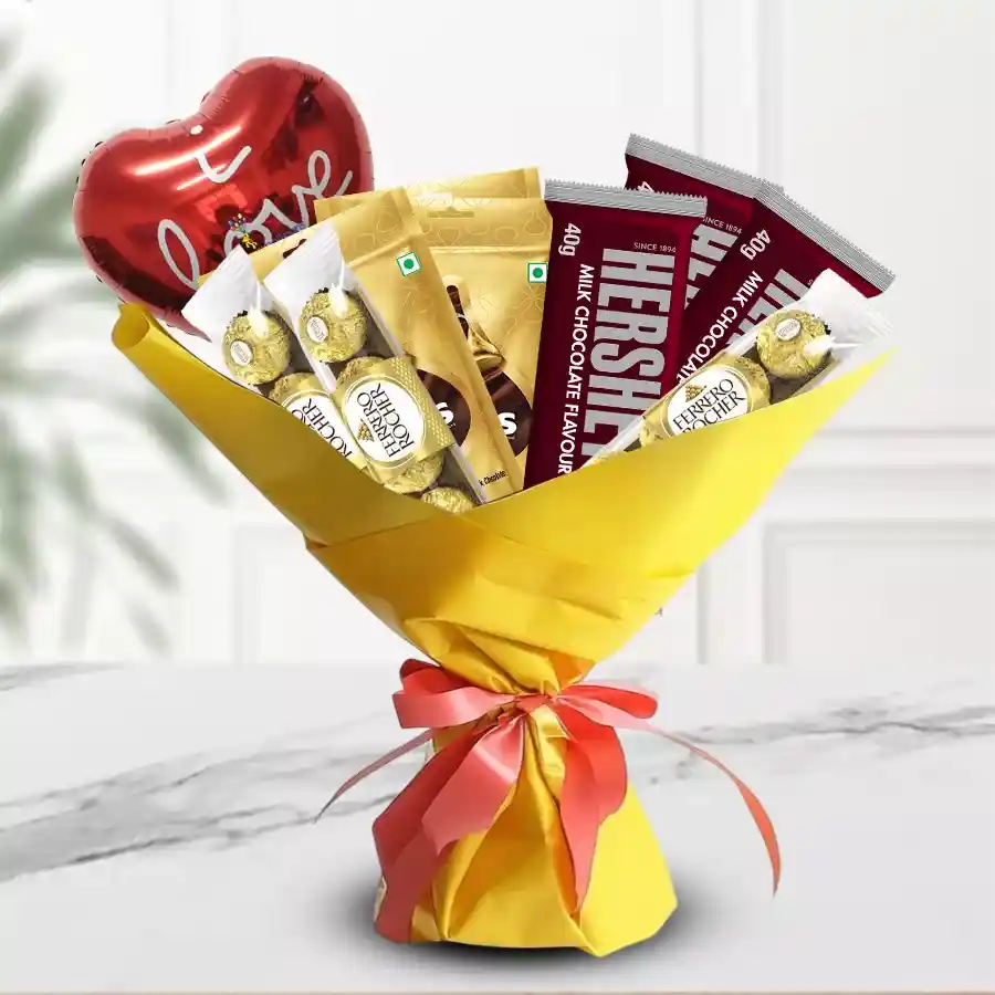 Mylar Balloon and Chocolates Bouquet featuring Hershey's Kisses Minis, Hershey's Kisses Bars, Ferrero Rocher, and a "I Love You" balloon, beautifully wrapped with ribbon.