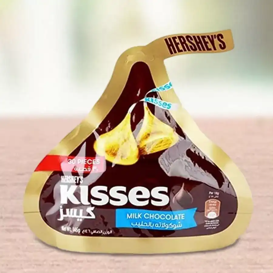 Hershey's Kisses Milk Chocolates in a 150 gm box, featuring creamy chocolate pieces perfect for sharing and celebrating special moments.