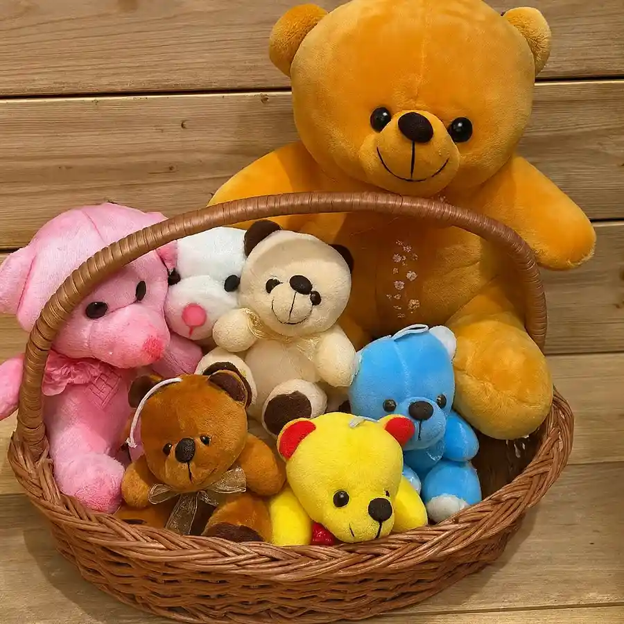 Colorful teddy bear basket featuring seven adorable teddies in a cane basket.