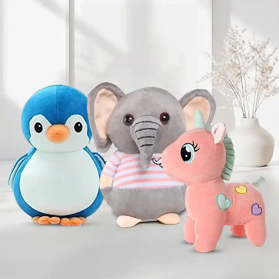 Charming trio of plush soft toys: unicorn, elephant, and penguin for kids.
