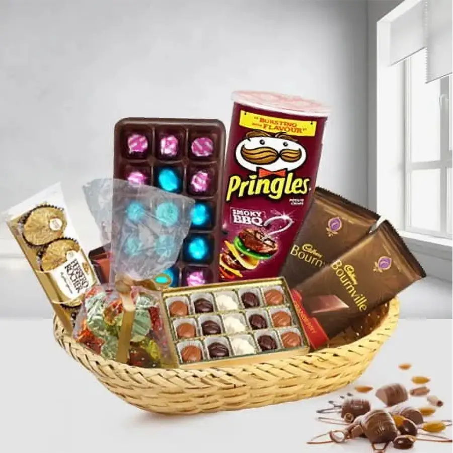 Delectable chocolates gift basket for Mother's Day featuring homemade chocolates, Cadbury Bournville bars, Ferrero Rocher, and Pringle Chips arranged in a charming cane basket