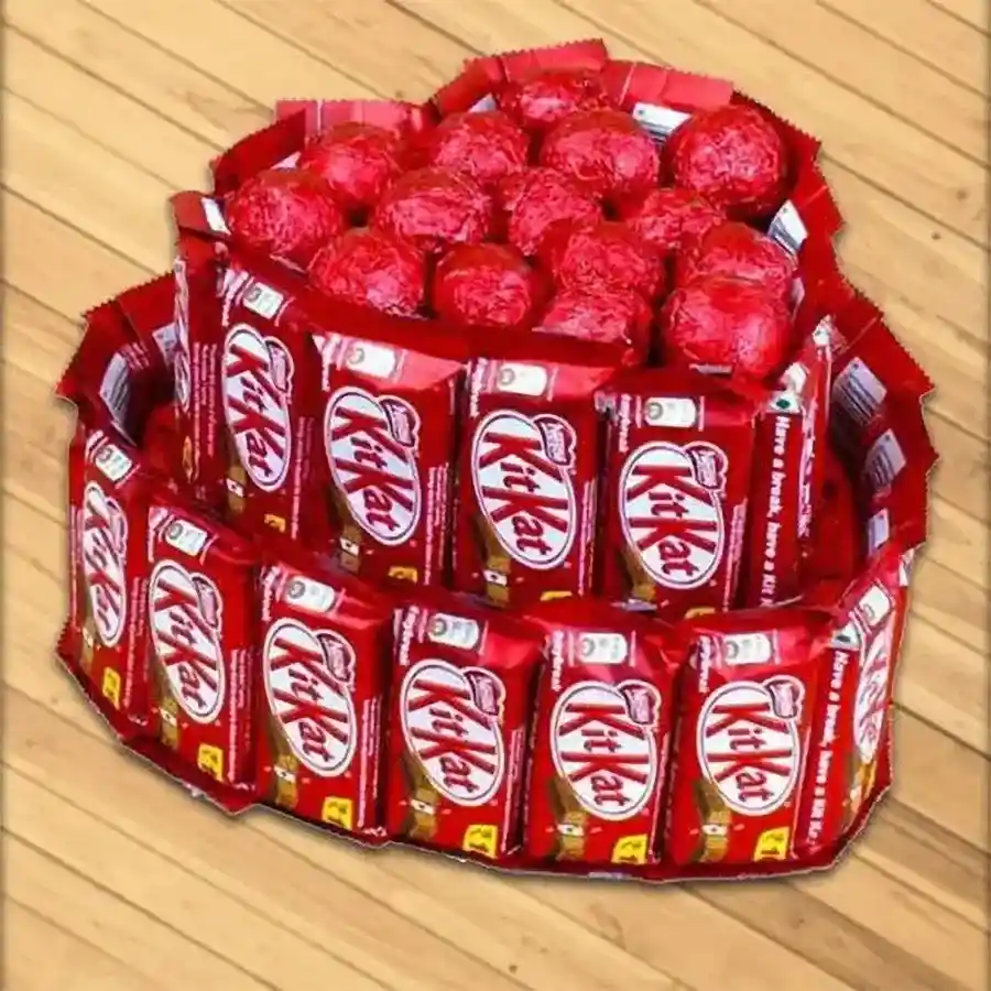 Heart-shaped arrangement of 35 Nestle KitKats and assorted handmade chocolates