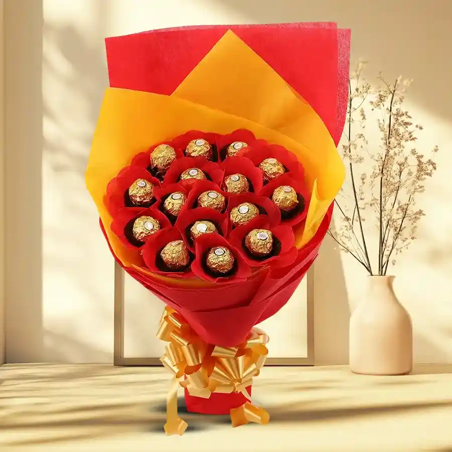 Bouquet of 16 Ferrero Rocher chocolates elegantly arranged with golden wrappers and tissue.