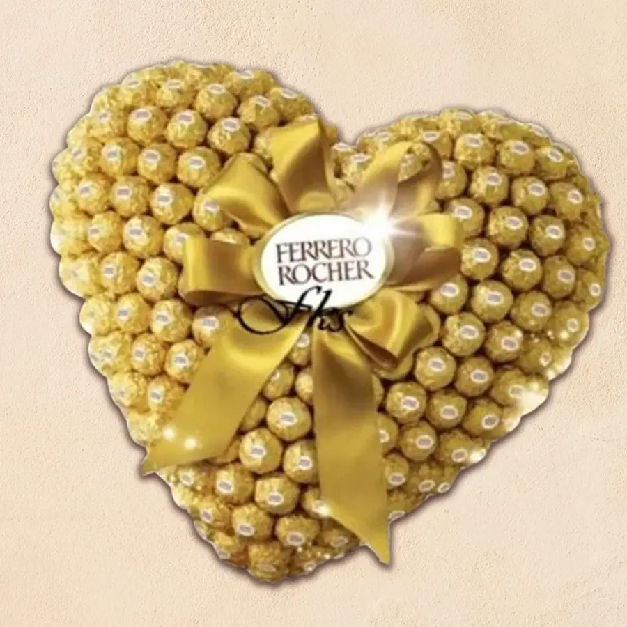 Heart-shaped arrangement of 48 Ferrero Rocher chocolates with a golden bow