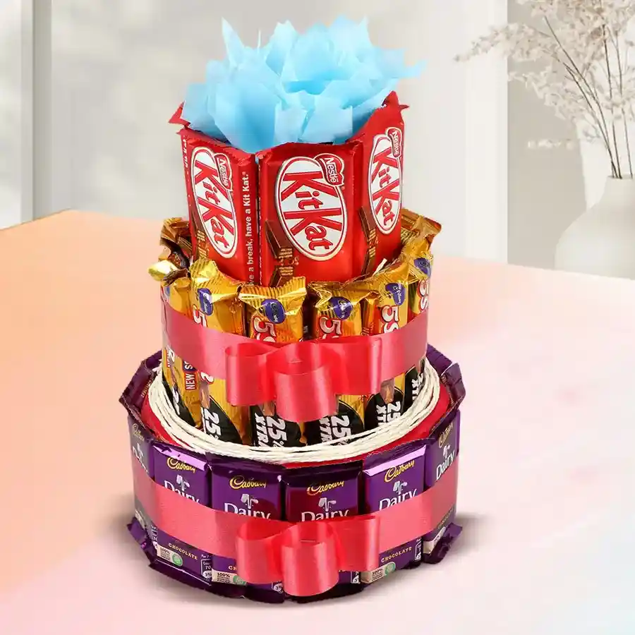 3-tier arrangement of assorted chocolates including Cadbury Dairy Milk bars, Cadbury Five Stars, and Nestle KitKats.