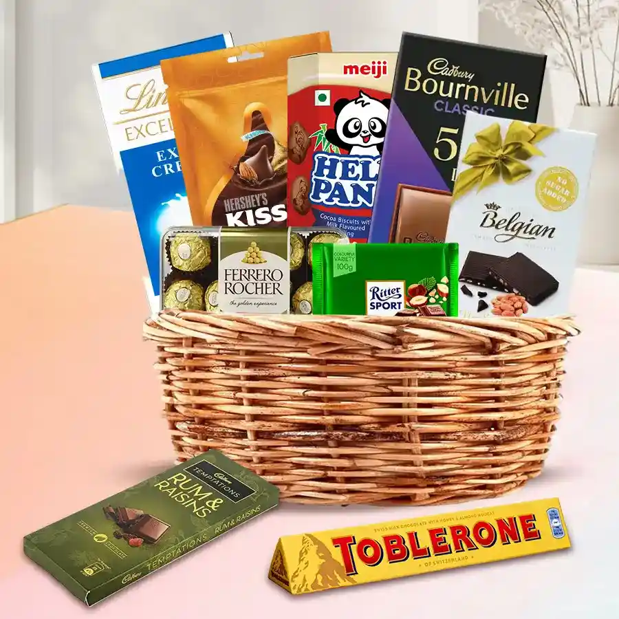 Enticing Chocolate Gift Basket filled with premium chocolates and biscuits arranged in a decorative basket.