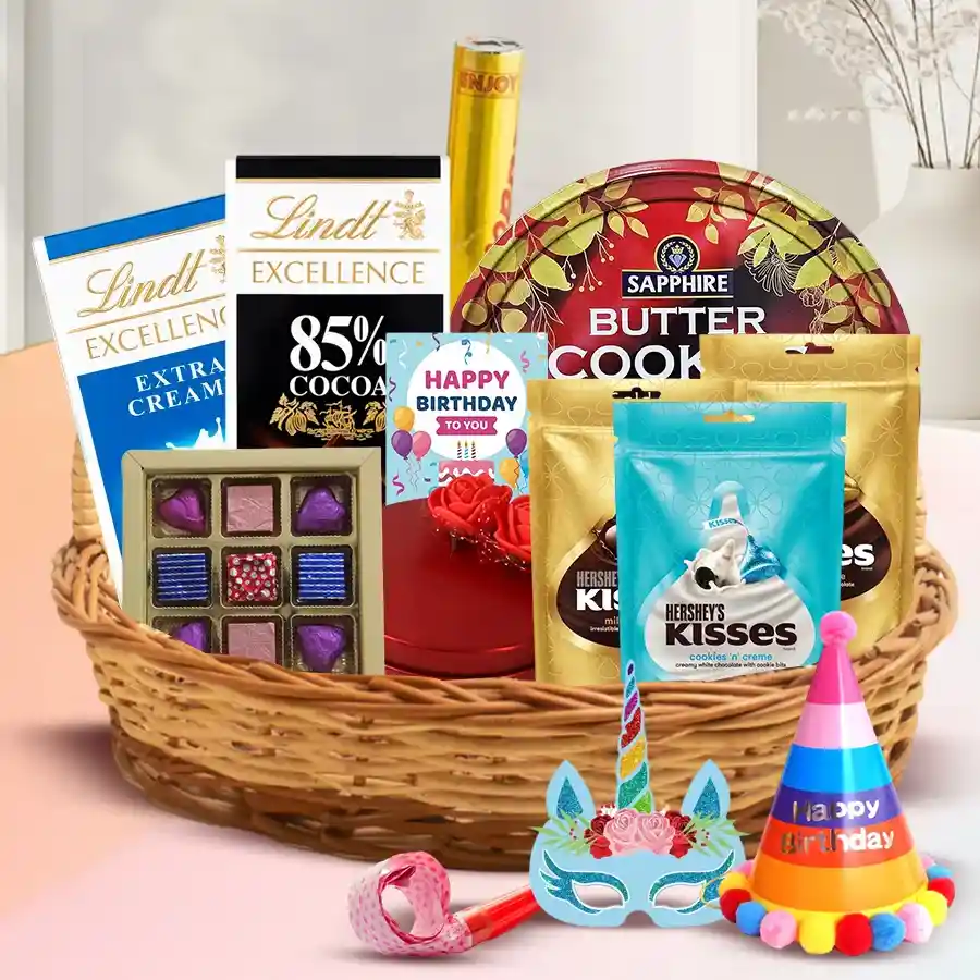 Enticing Chocolate Gift Basket featuring Lindt bars, Hershey Kisses, handmade chocolates, Danish cookies, and party accessories, beautifully arranged with a heartfelt card