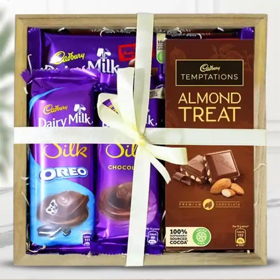 Exquisite Cadbury chocolate gift tray with assorted chocolate bars and a wooden tray.