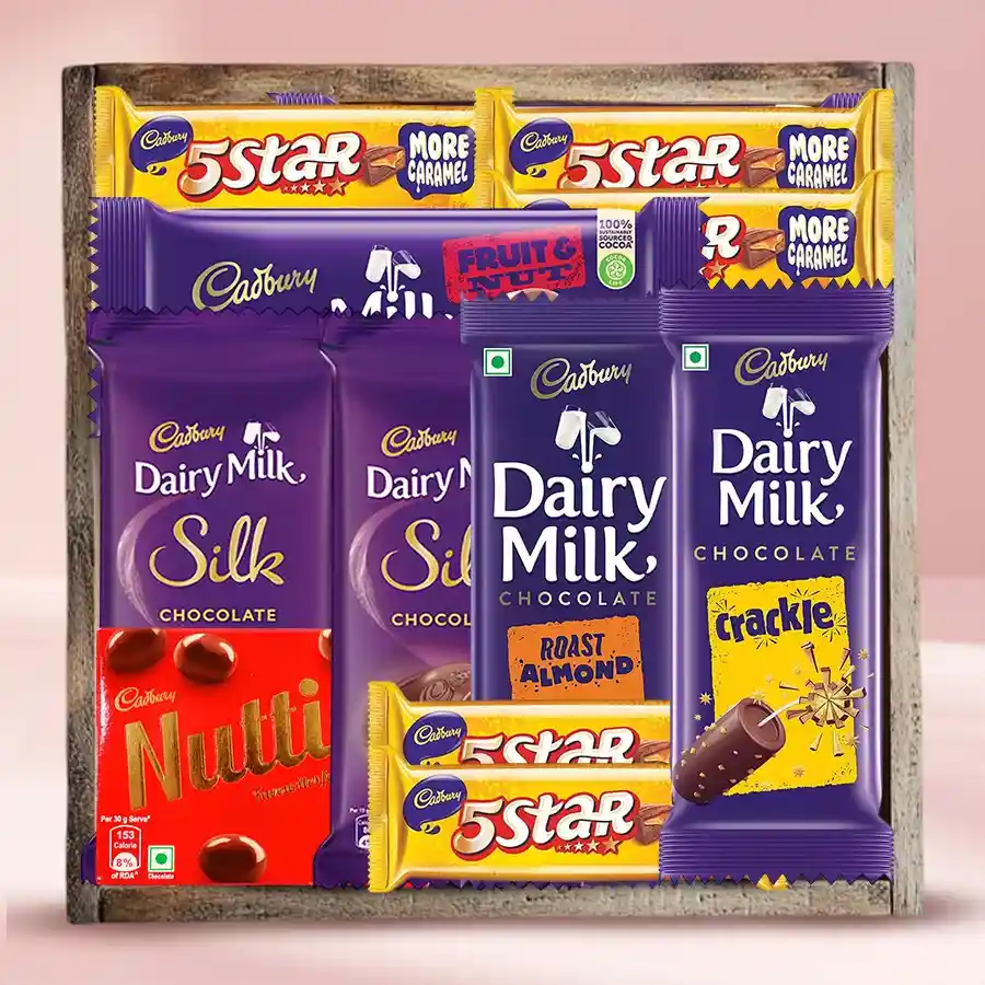 Luxurious Cadbury Treats Gift Tray with assorted chocolates and wooden tray.