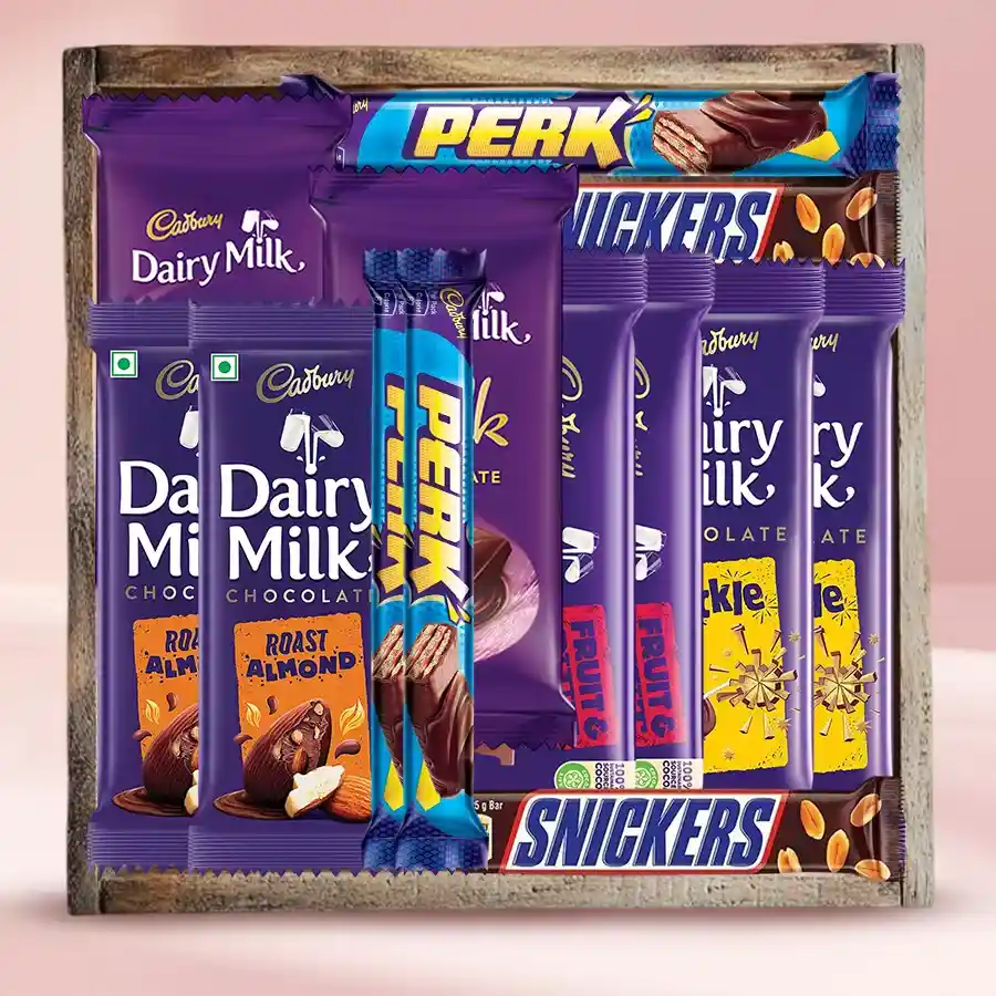 Decadent Chocolate Lovers’ Delight Hamper featuring various Cadbury chocolates and Snickers in a premium wooden gift tray.