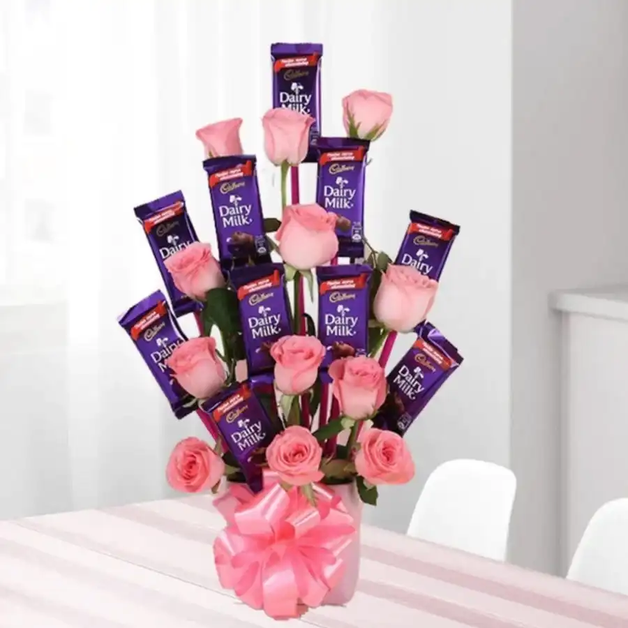 A beautiful bouquet of 12 roses accompanied by 10 Cadbury Dairy Milk chocolates, perfect for gifting on special occasions.