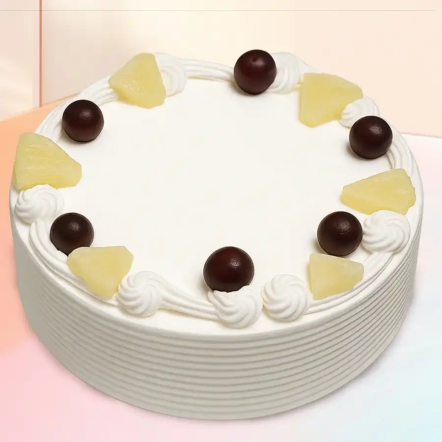 Freshly baked Pineapple Paradise Celebration Cake, perfect for special occasions, weighing 500 grams and available for delivery in Bangalore.
