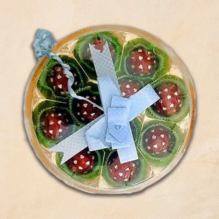 Assortment of Rum Ball Handmade Chocolates in a decorative box, featuring rich chocolate truffles filled with premium rum.