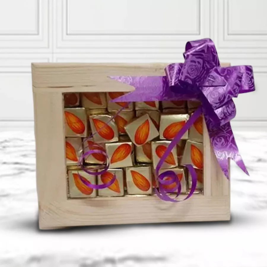Almond Chocolates in a wooden box alongside a beautifully designed pooja thali.