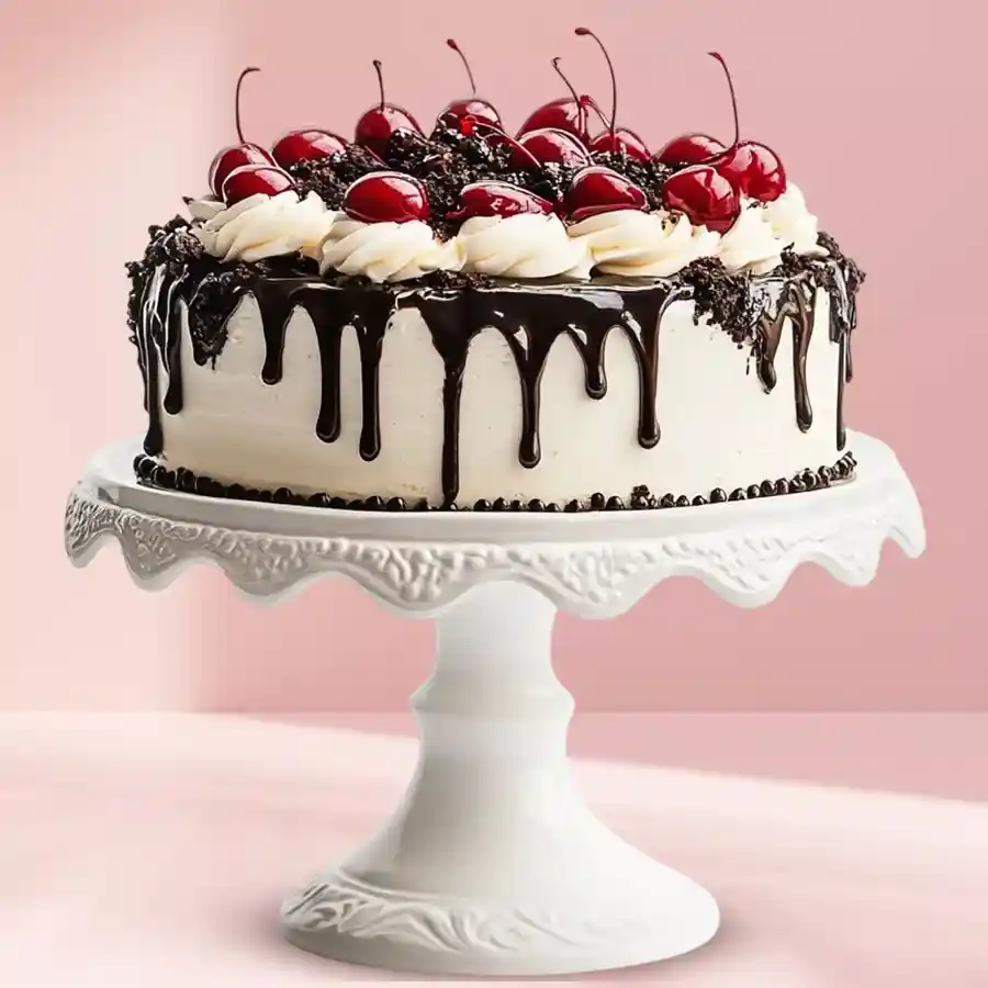 1 lb Scrumptious Black Forest Cake, decorated with cherries and whipped cream.